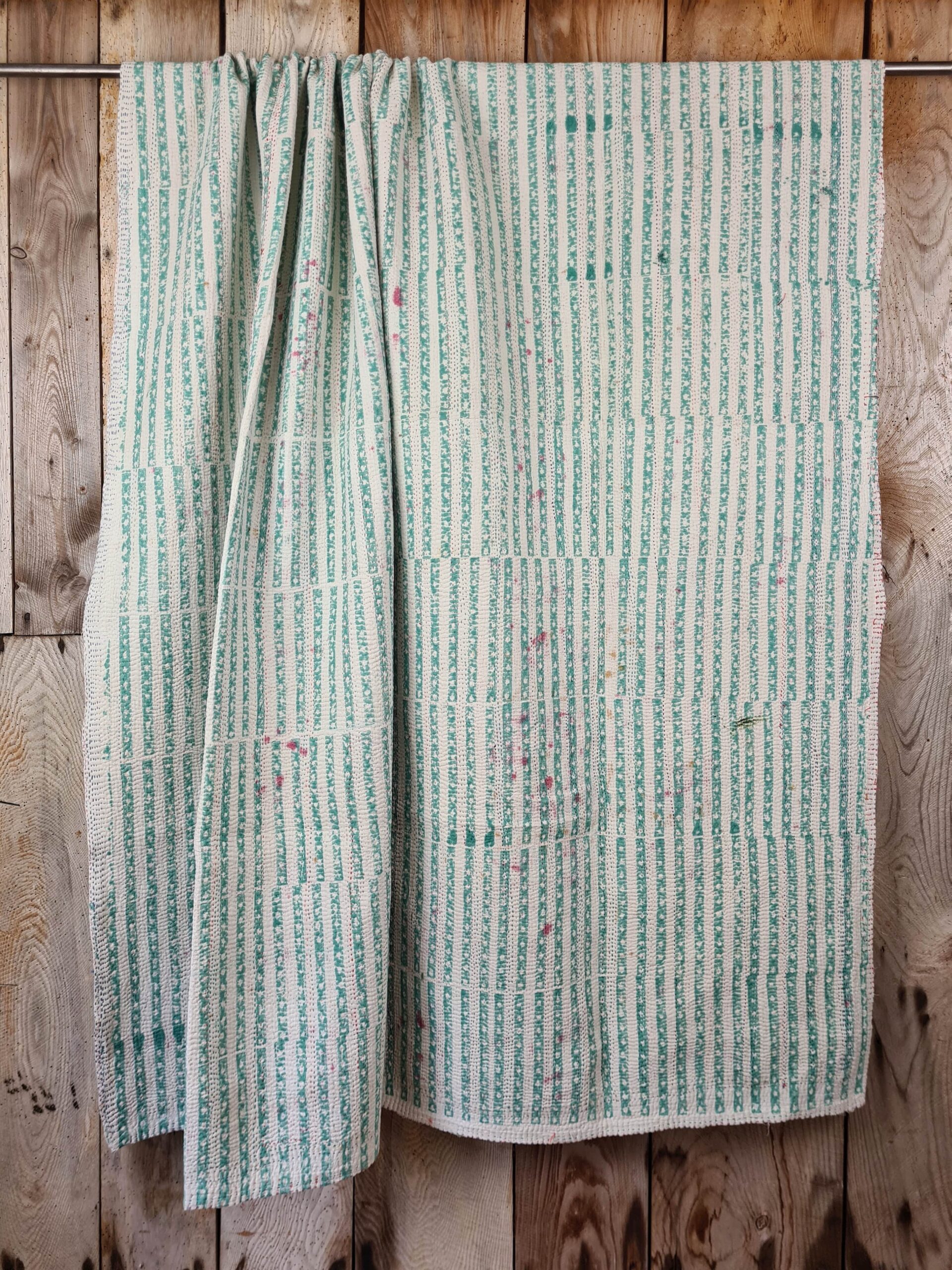 Exquisite vintage Kantha quilt featuring authentic hand-stitched Indian patchwork, responsibly sourced and perfect as unique homeware.