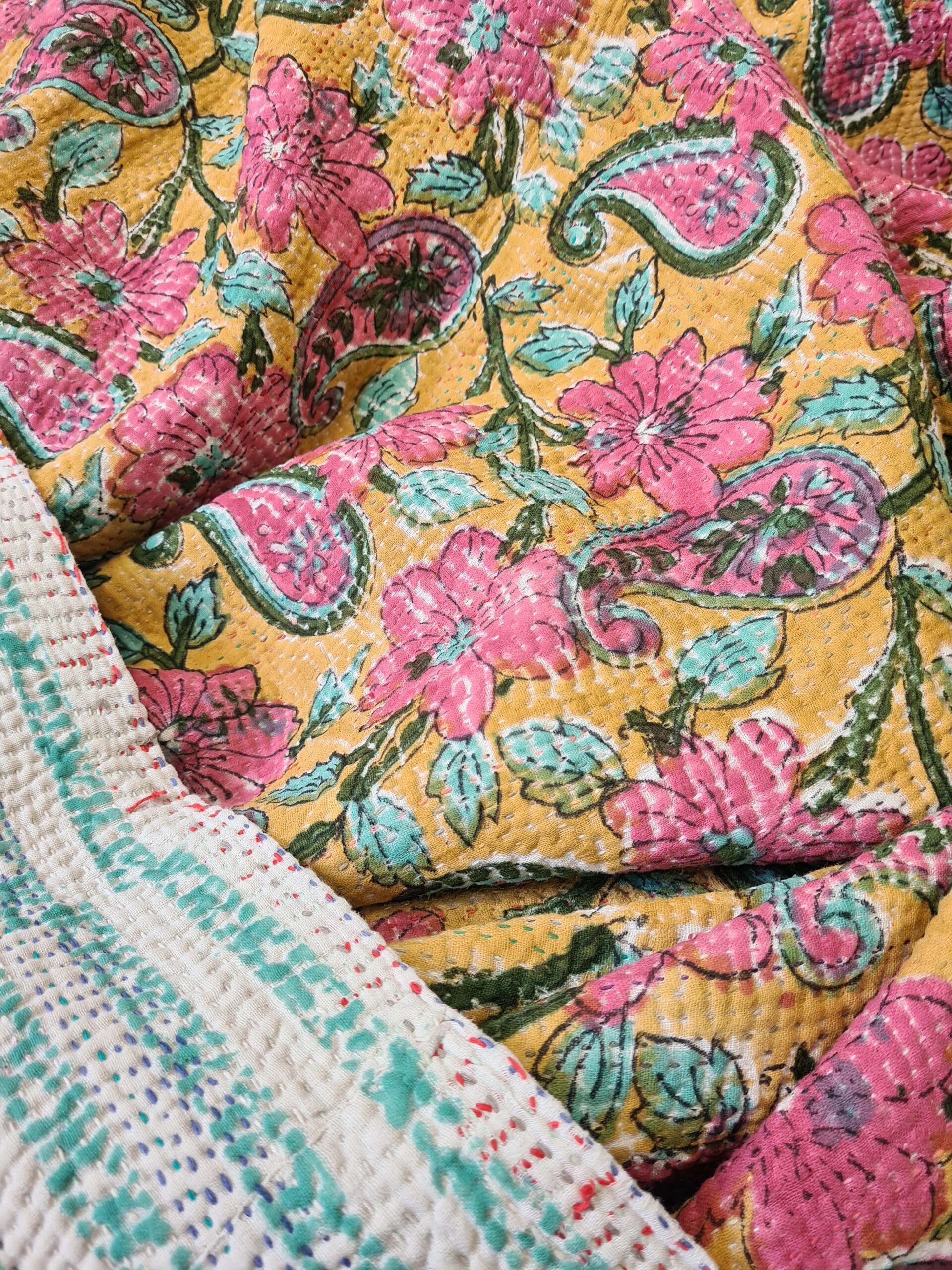 Exquisite vintage Kantha quilt featuring authentic hand-stitched Indian patchwork, responsibly sourced and perfect as unique homeware.