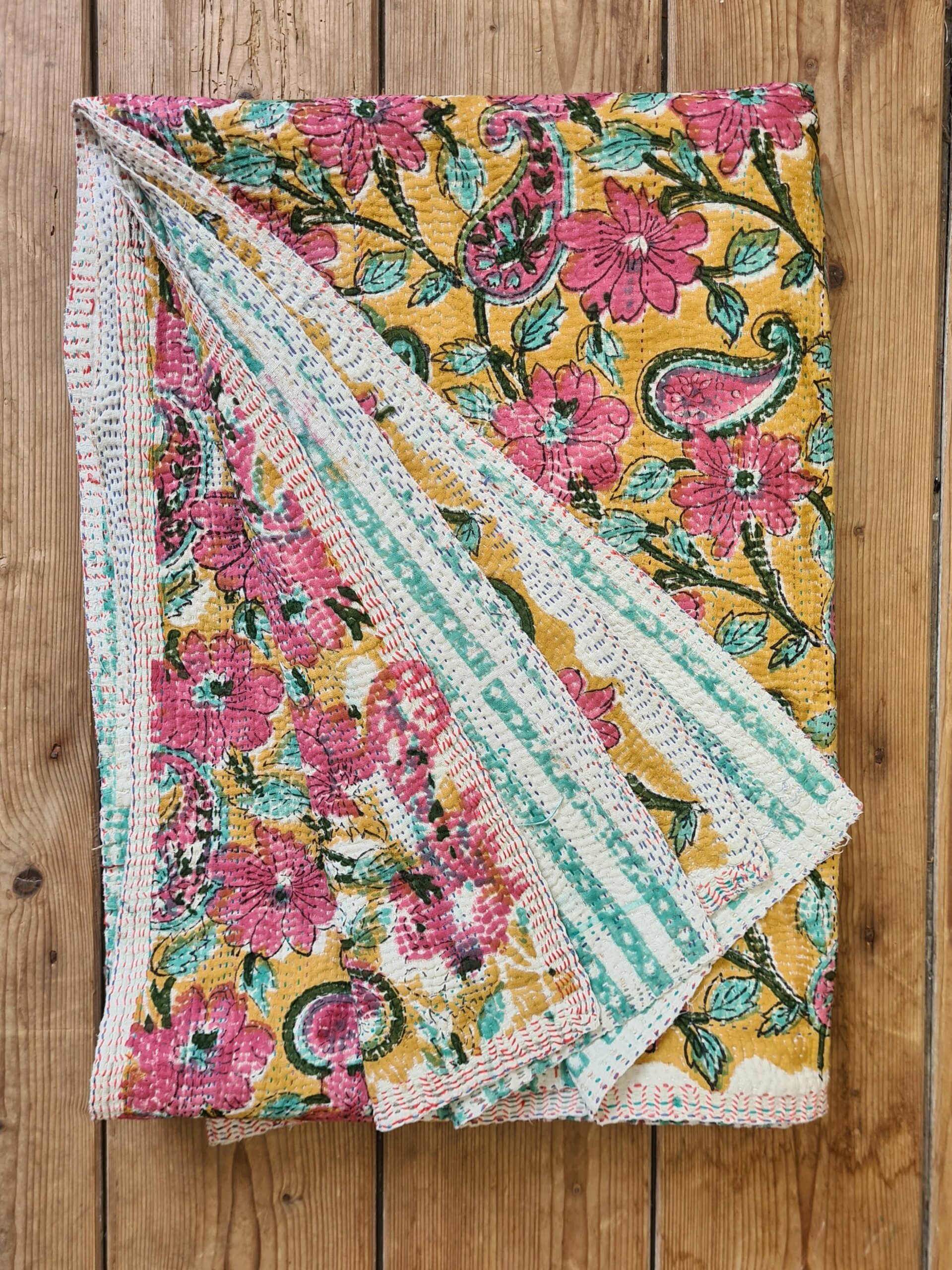 Exquisite vintage Kantha quilt featuring authentic hand-stitched Indian patchwork, responsibly sourced and perfect as unique homeware.