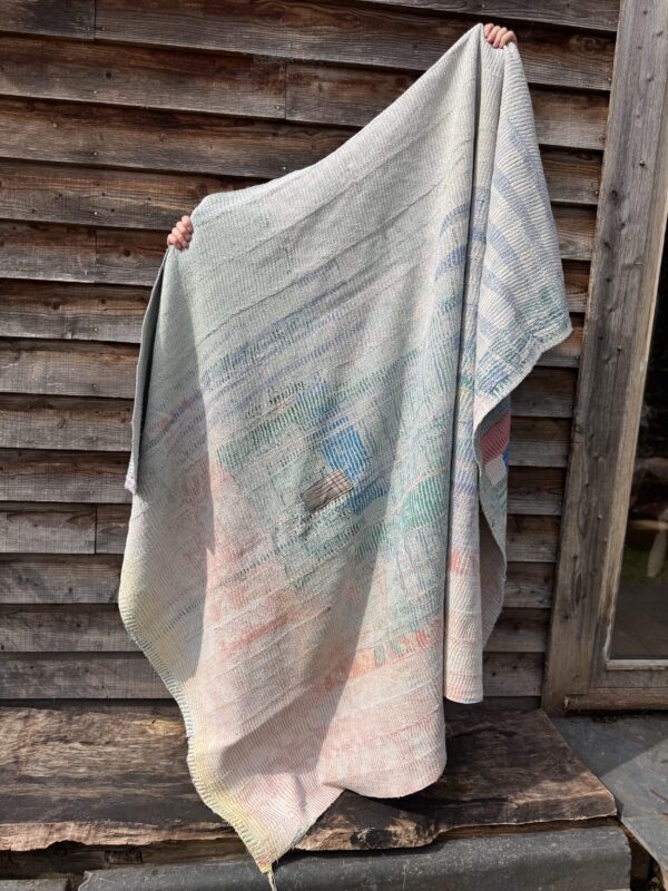 Exquisite vintage Kantha quilt featuring authentic hand-stitched Indian patchwork, responsibly sourced and perfect as unique homeware.