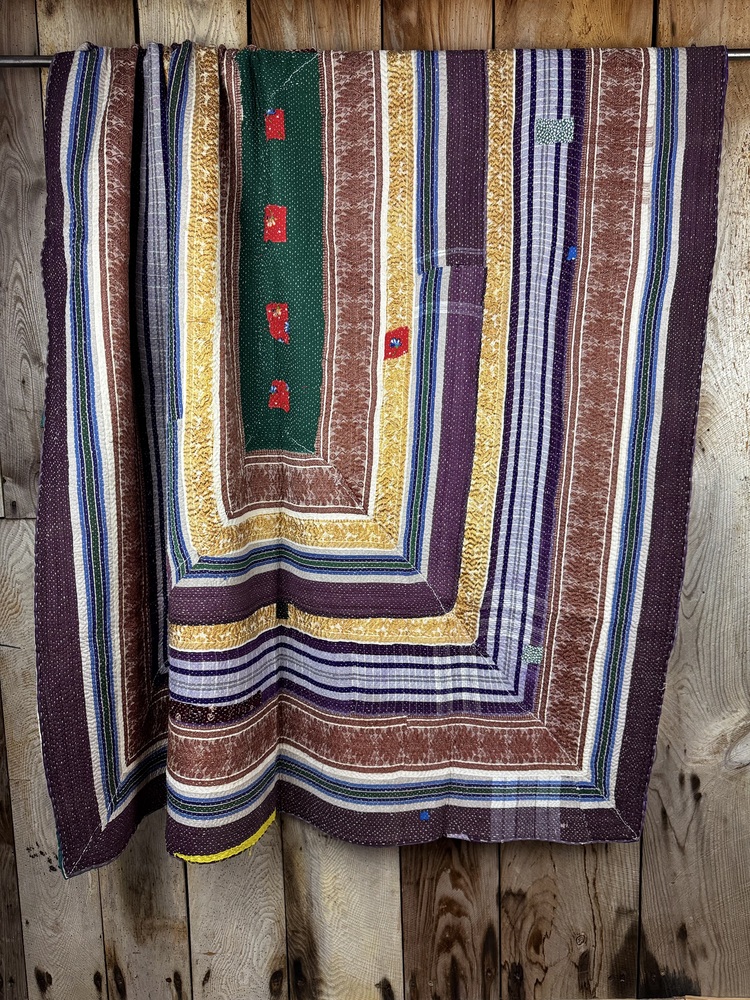 Exquisite vintage Kantha quilt featuring authentic hand-stitched Indian patchwork, responsibly sourced and perfect as unique homeware.
