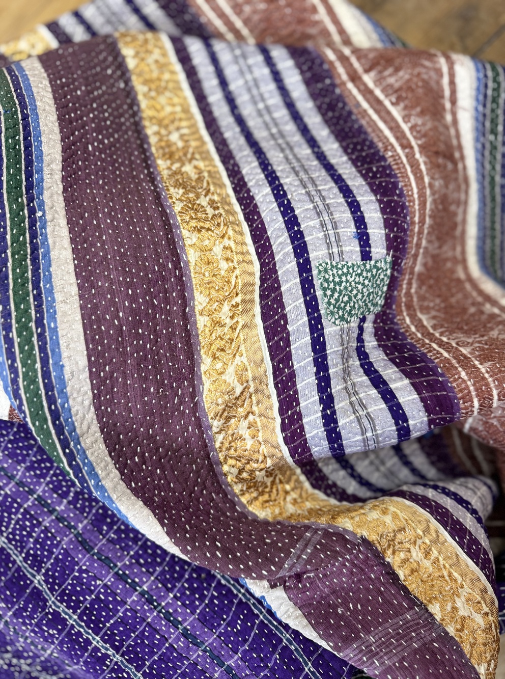 Exquisite vintage Kantha quilt featuring authentic hand-stitched Indian patchwork, responsibly sourced and perfect as unique homeware.