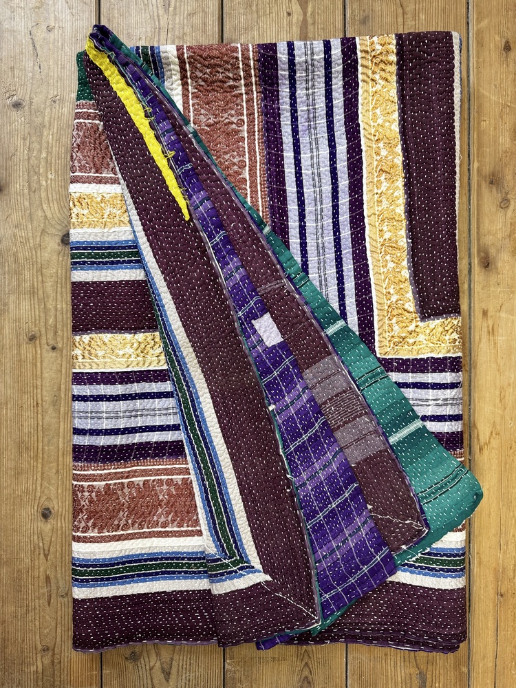 Exquisite vintage Kantha quilt featuring authentic hand-stitched Indian patchwork, responsibly sourced and perfect as unique homeware.