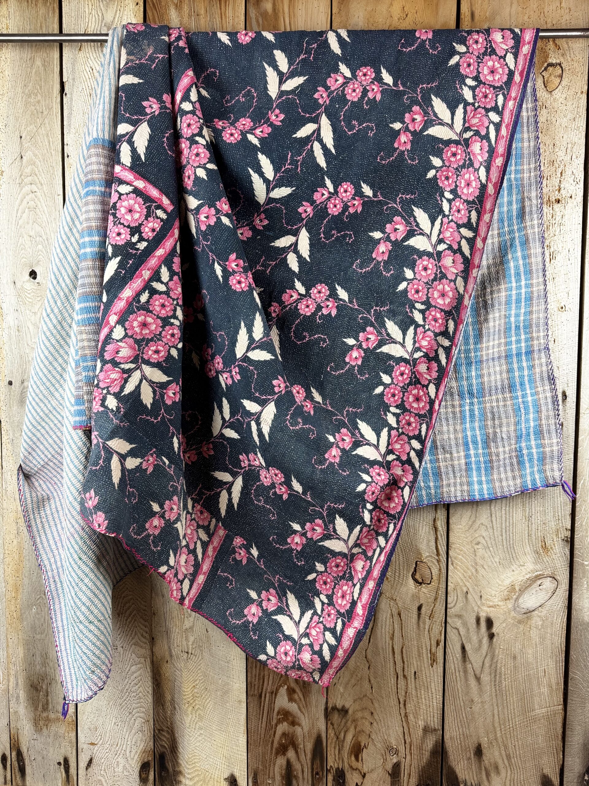 Exquisite vintage Kantha quilt featuring authentic hand-stitched Indian patchwork, responsibly sourced and perfect as unique homeware.