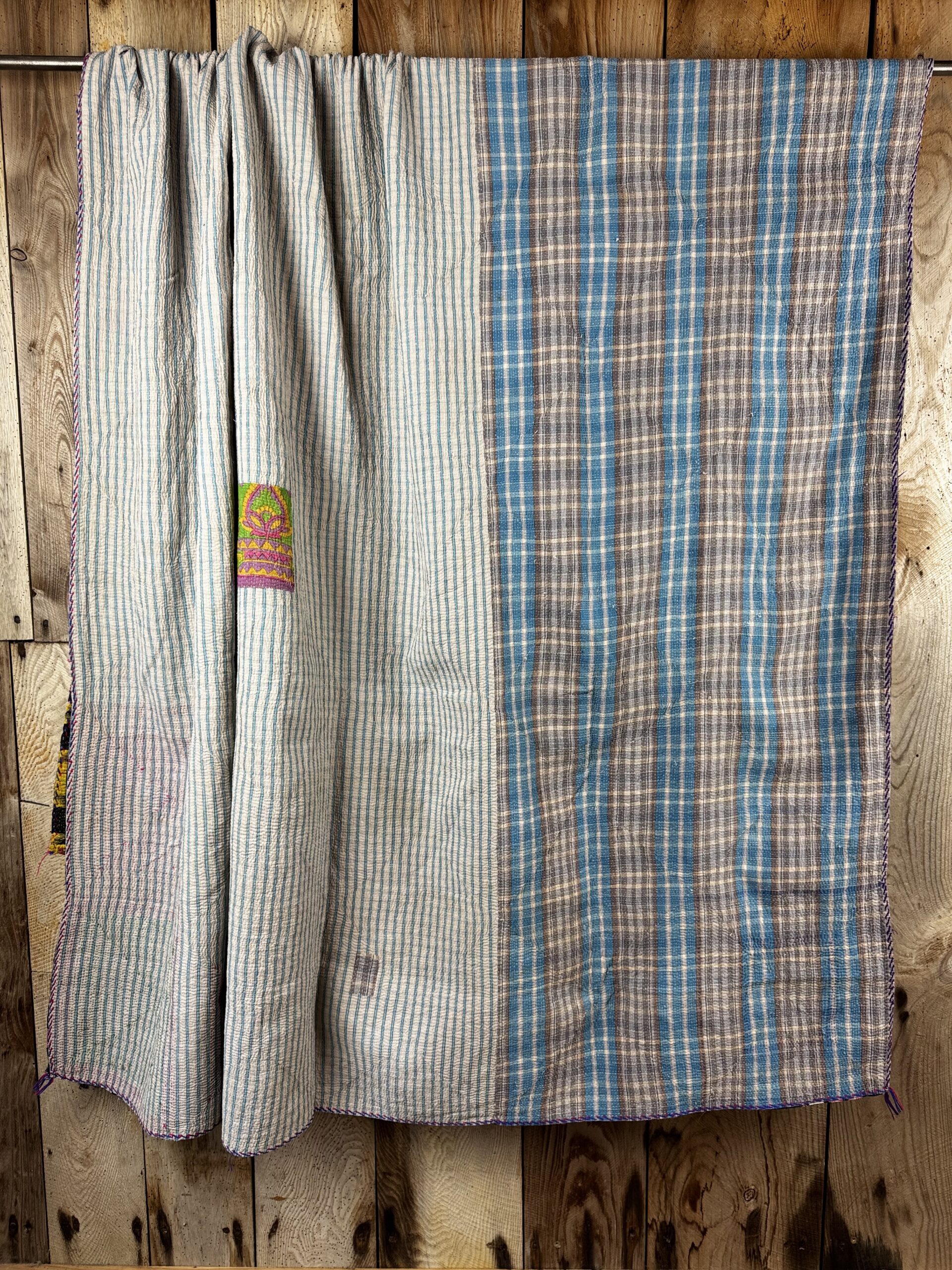 Exquisite vintage Kantha quilt featuring authentic hand-stitched Indian patchwork, responsibly sourced and perfect as unique homeware.