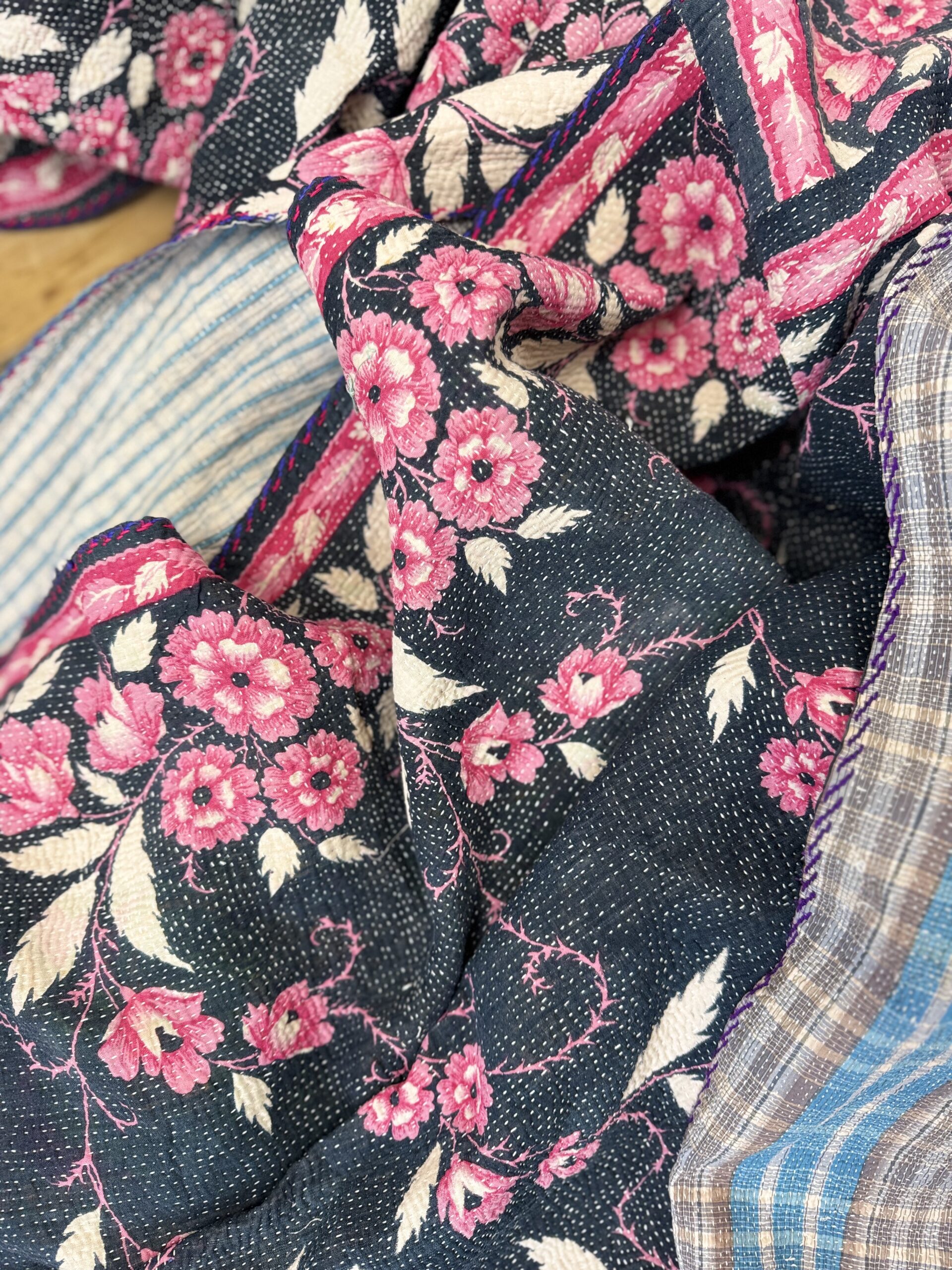 Exquisite vintage Kantha quilt featuring authentic hand-stitched Indian patchwork, responsibly sourced and perfect as unique homeware.