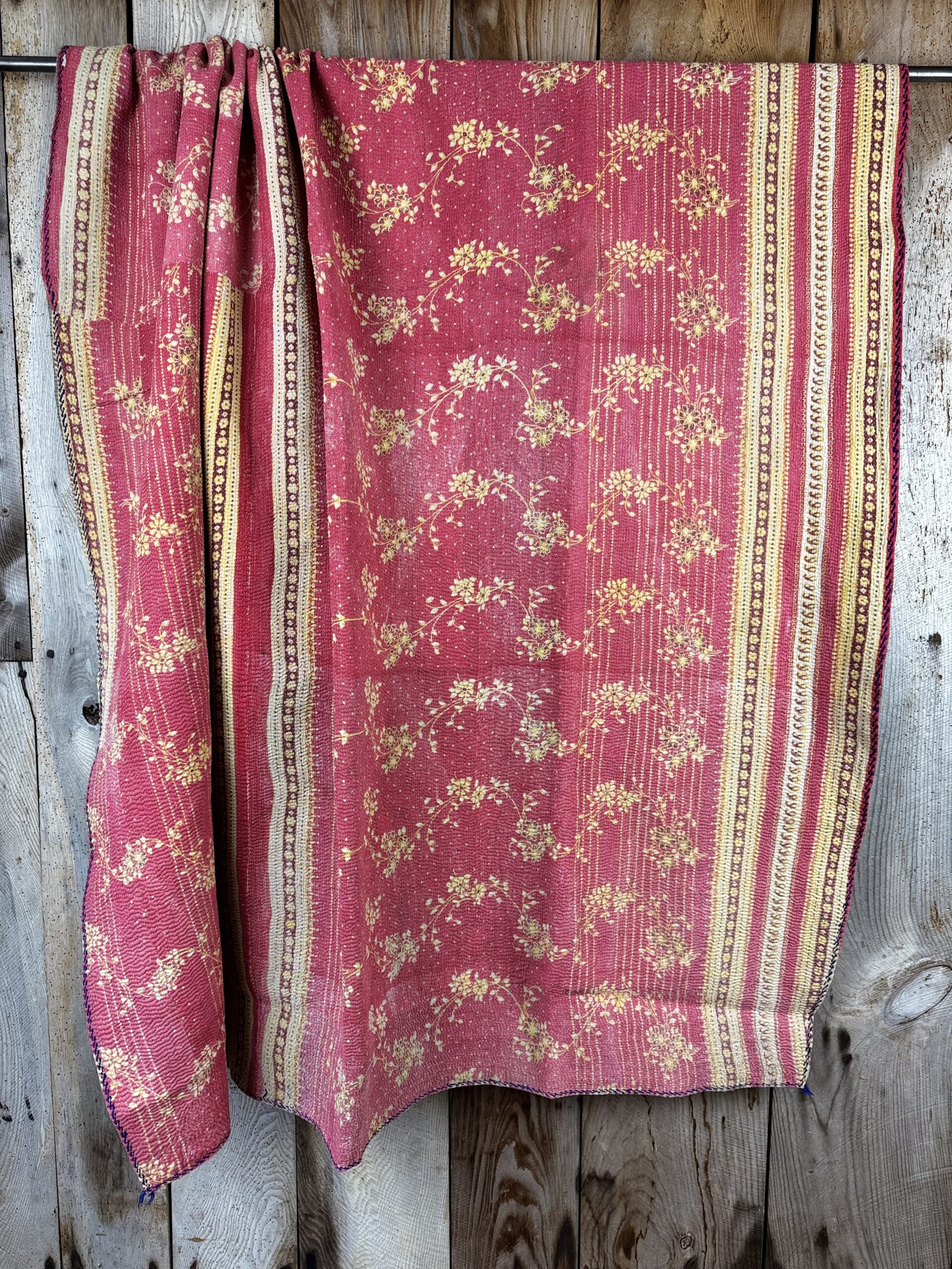 Exquisite vintage Kantha quilt featuring authentic hand-stitched Indian patchwork, responsibly sourced and perfect as unique homeware.