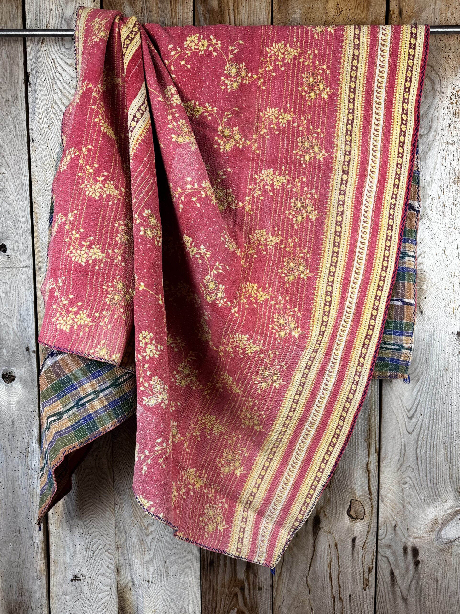Exquisite vintage Kantha quilt featuring authentic hand-stitched Indian patchwork, responsibly sourced and perfect as unique homeware.