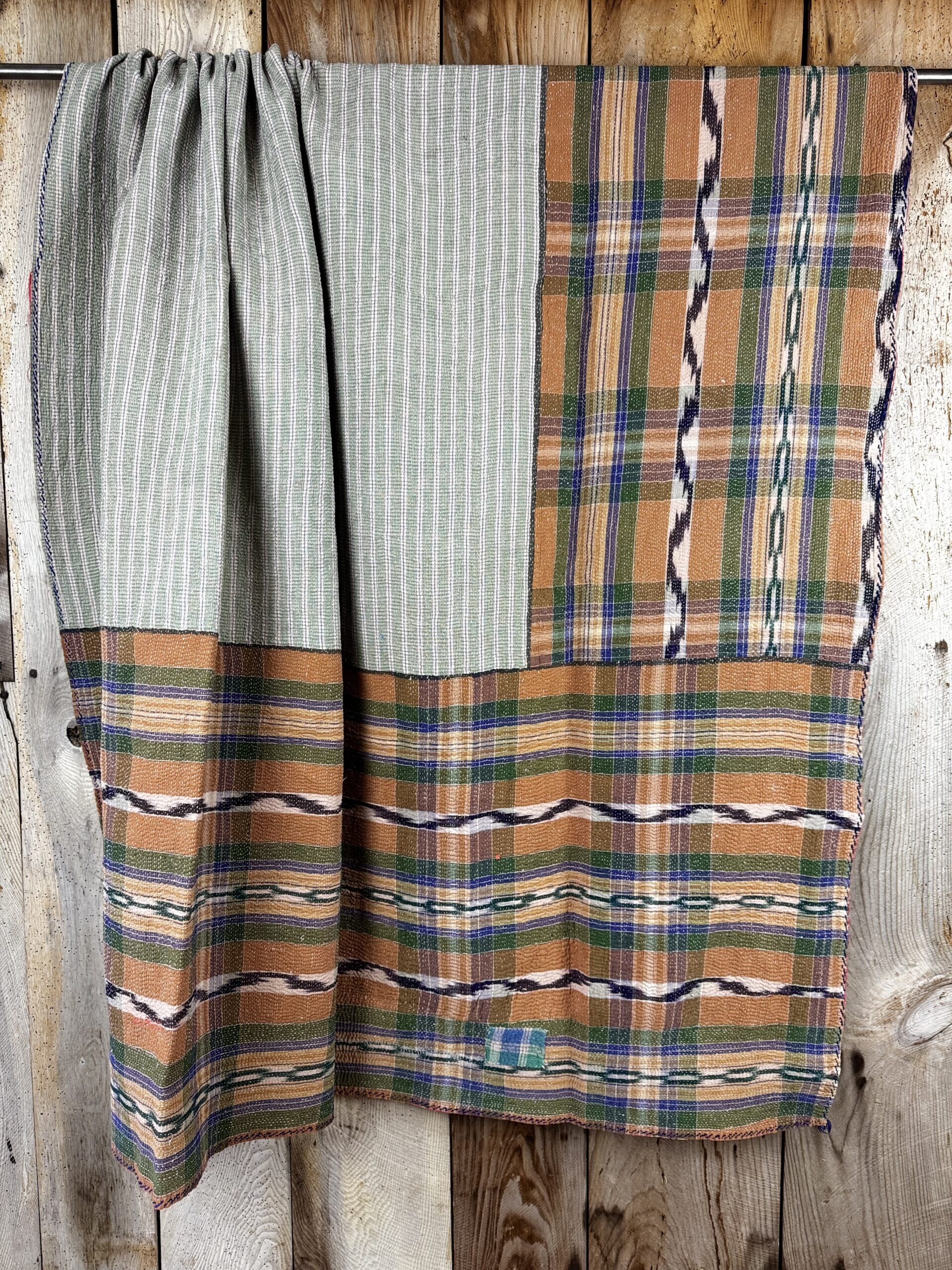 Exquisite vintage Kantha quilt featuring authentic hand-stitched Indian patchwork, responsibly sourced and perfect as unique homeware.