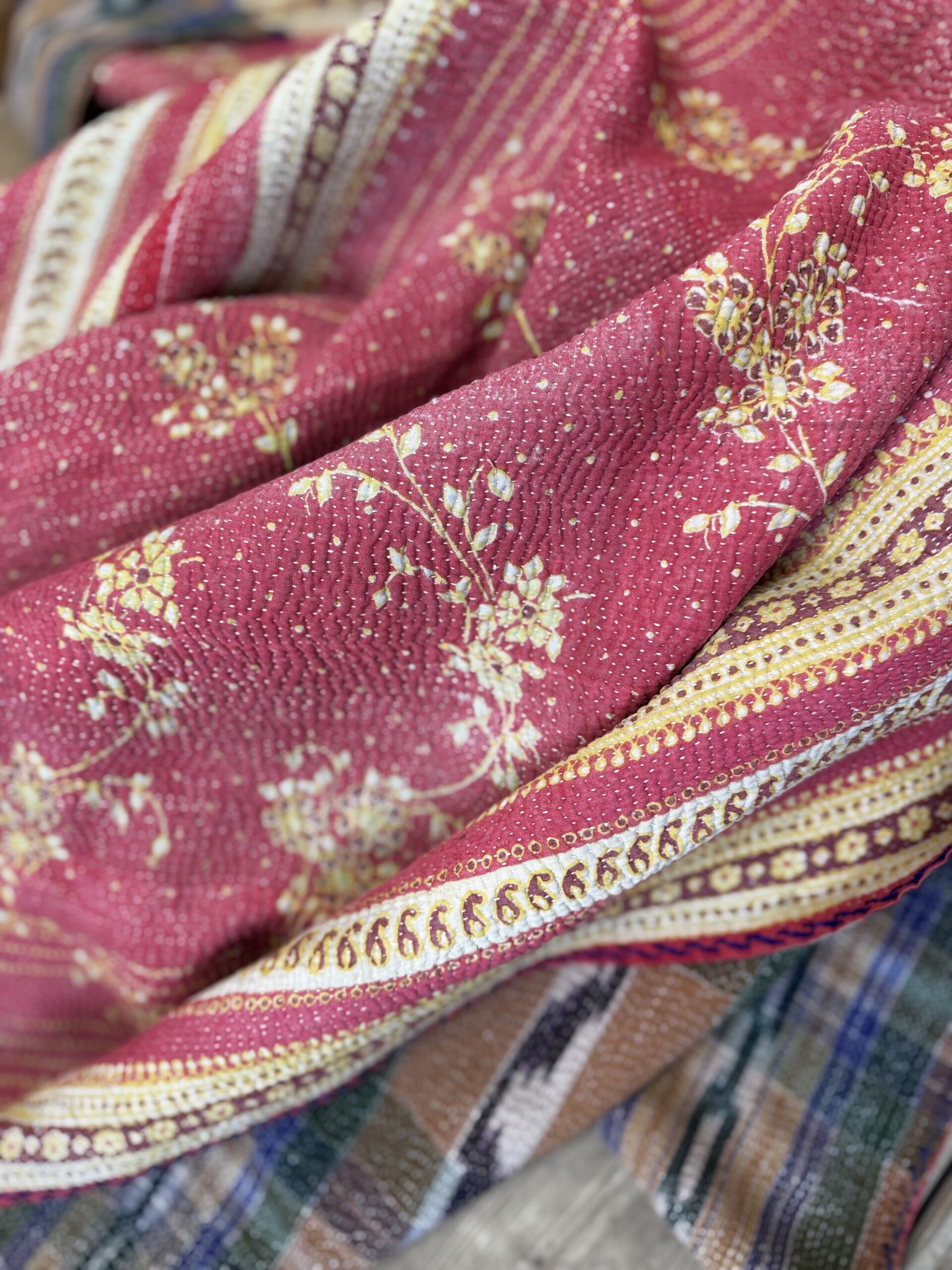 Exquisite vintage Kantha quilt featuring authentic hand-stitched Indian patchwork, responsibly sourced and perfect as unique homeware.