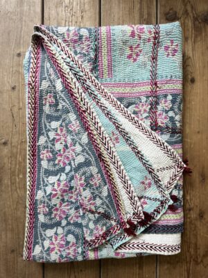 Exquisite vintage Kantha quilt featuring authentic hand-stitched Indian patchwork, responsibly sourced and perfect as unique homeware.