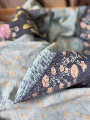 Exquisite vintage Kantha quilt featuring authentic hand-stitched Indian patchwork, responsibly sourced and perfect as unique homeware.