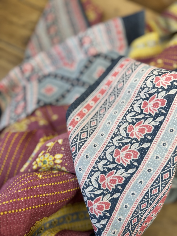 Exquisite vintage Kantha quilt featuring authentic hand-stitched Indian patchwork, responsibly sourced and perfect as unique homeware.