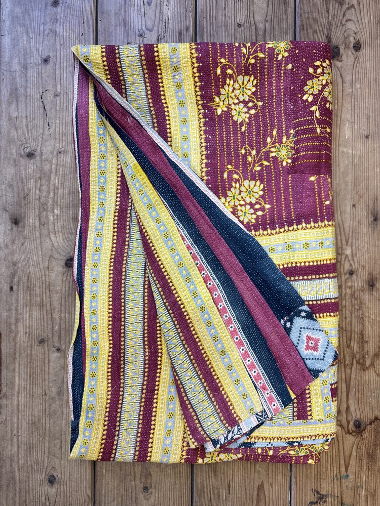 Exquisite vintage Kantha quilt featuring authentic hand-stitched Indian patchwork, responsibly sourced and perfect as unique homeware.