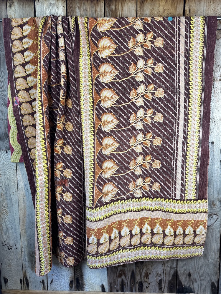 Exquisite vintage Kantha quilt featuring authentic hand-stitched Indian patchwork, responsibly sourced and perfect as unique homeware.