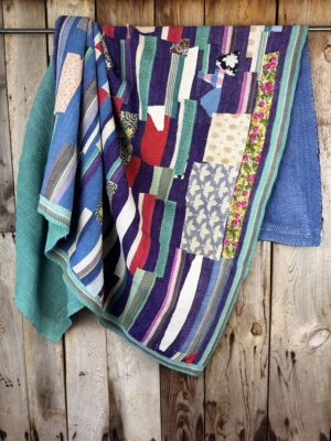 Exquisite vintage Kantha quilt featuring authentic hand-stitched Indian patchwork, responsibly sourced and perfect as unique homeware.