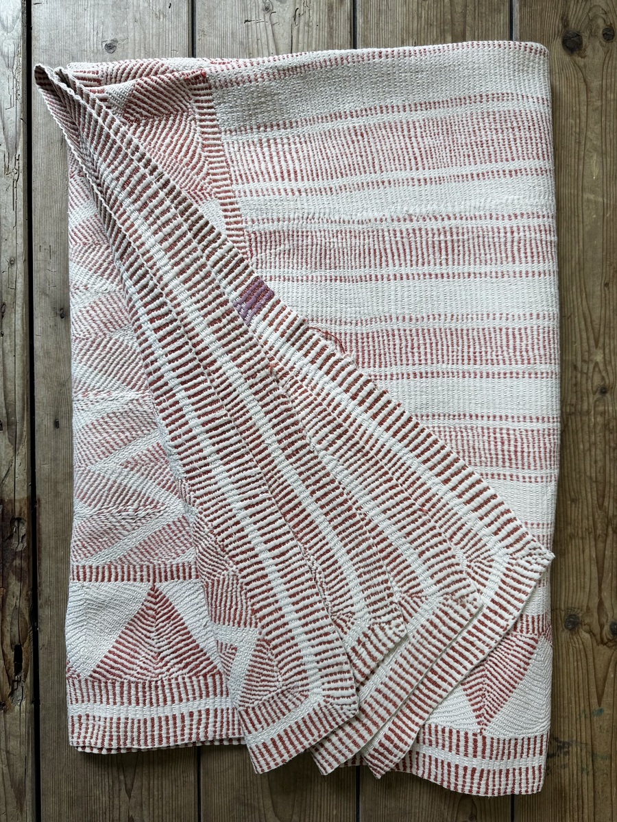 Exquisite vintage Lohori Kantha quilt featuring authentic hand-stitched Indian patchwork, responsibly sourced and perfect as unique homeware.