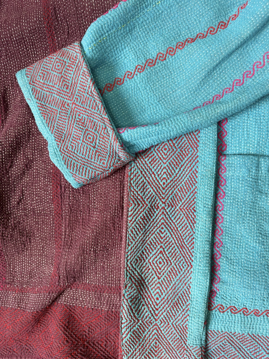 Vintage cotton Clara Kantha Jacket with finely hand stitched details, rich textures and colours.
