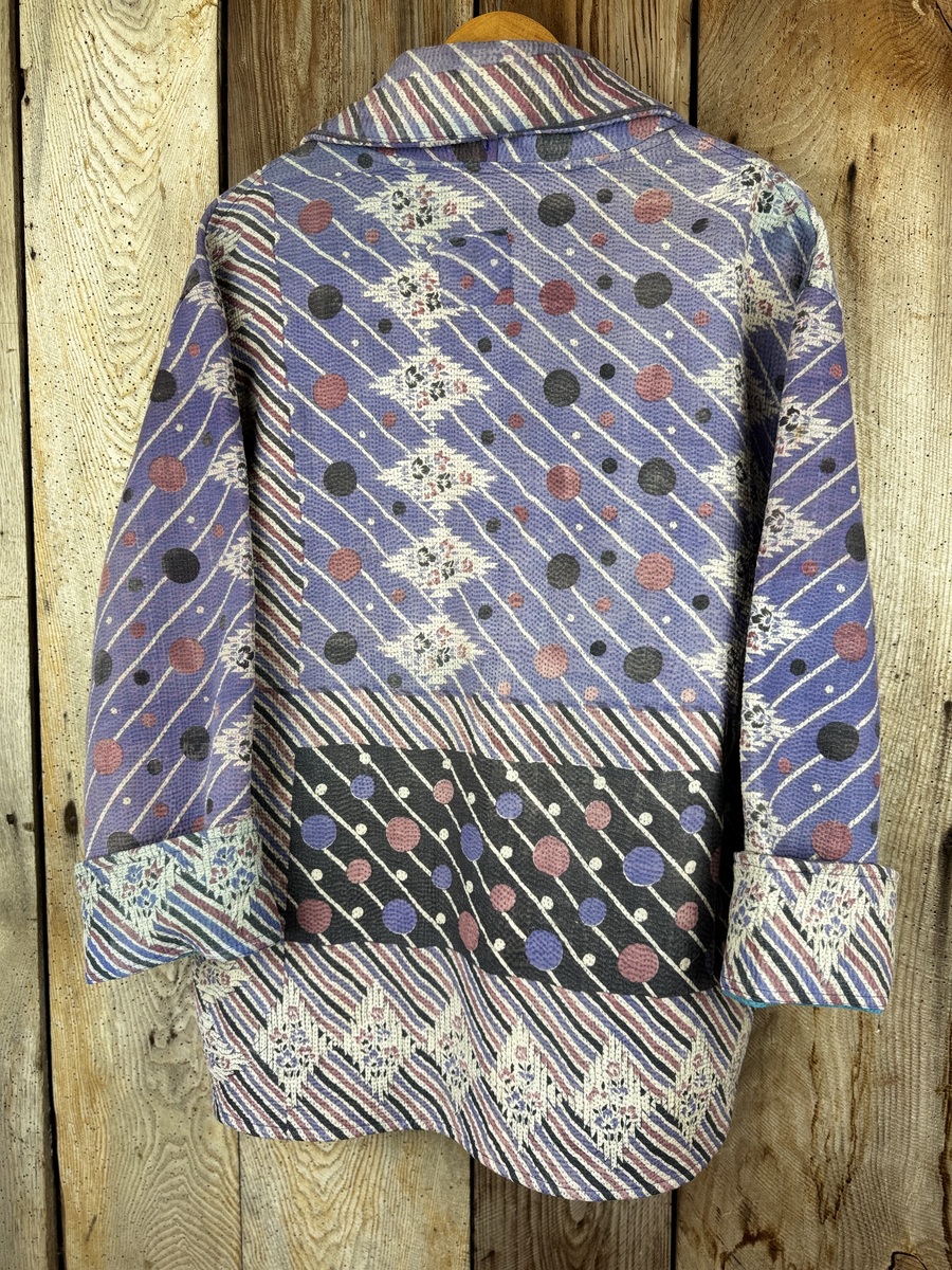 Vintage cotton Clara Kantha Jacket with finely hand stitched details, rich textures and colours.