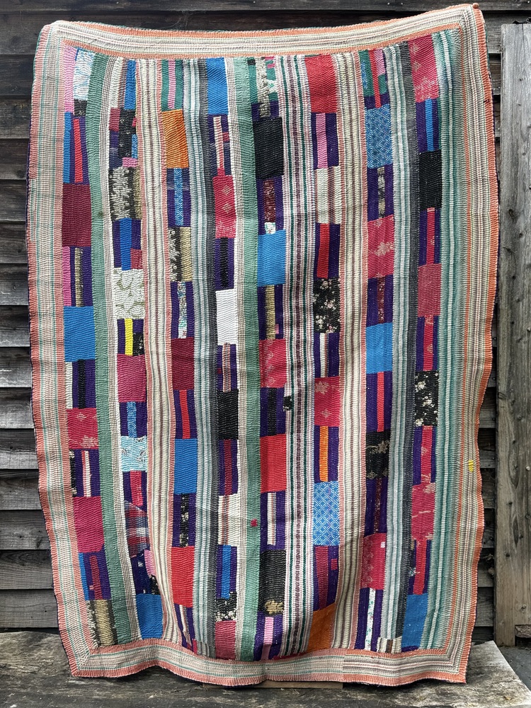 Exquisite vintage Kantha quilt featuring authentic hand-stitched Indian patchwork, responsibly sourced and perfect as unique homeware.