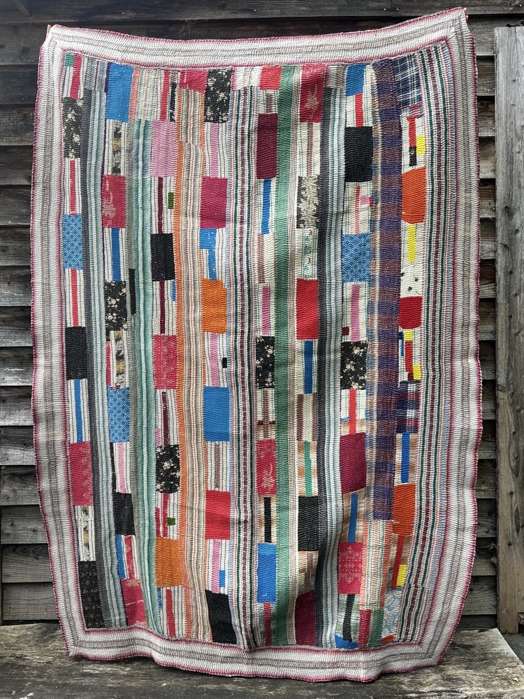 Exquisite vintage Kantha quilt featuring authentic hand-stitched Indian patchwork, responsibly sourced and perfect as unique homeware.