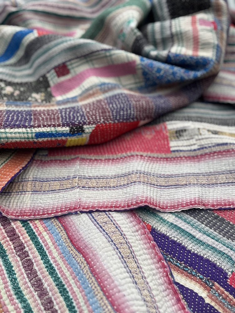 Exquisite vintage Kantha quilt featuring authentic hand-stitched Indian patchwork, responsibly sourced and perfect as unique homeware.