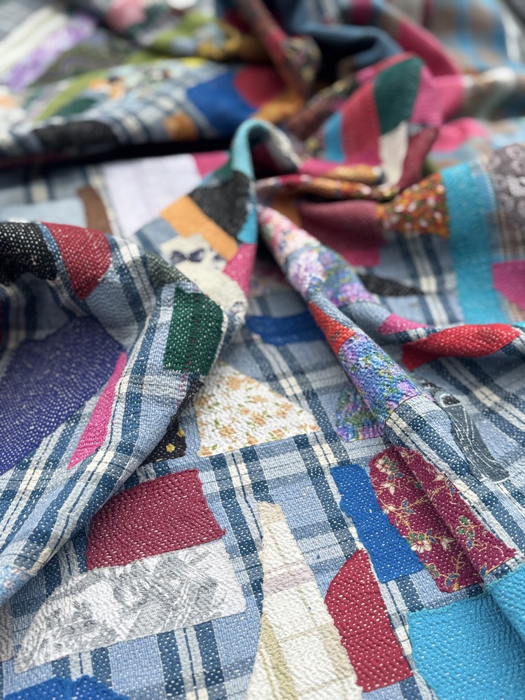 Exquisite vintage Kantha quilt featuring authentic hand-stitched Indian patchwork, responsibly sourced and perfect as unique homeware.