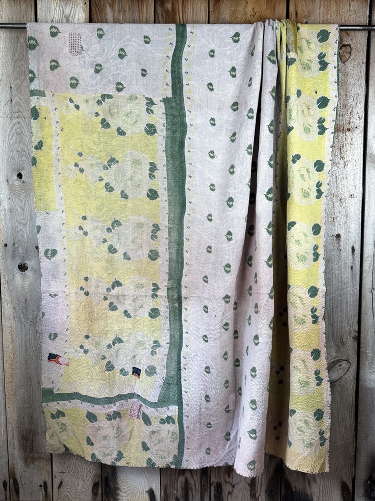 Exquisite vintage Kantha quilt featuring authentic hand-stitched Indian patchwork, responsibly sourced and perfect as unique homeware.