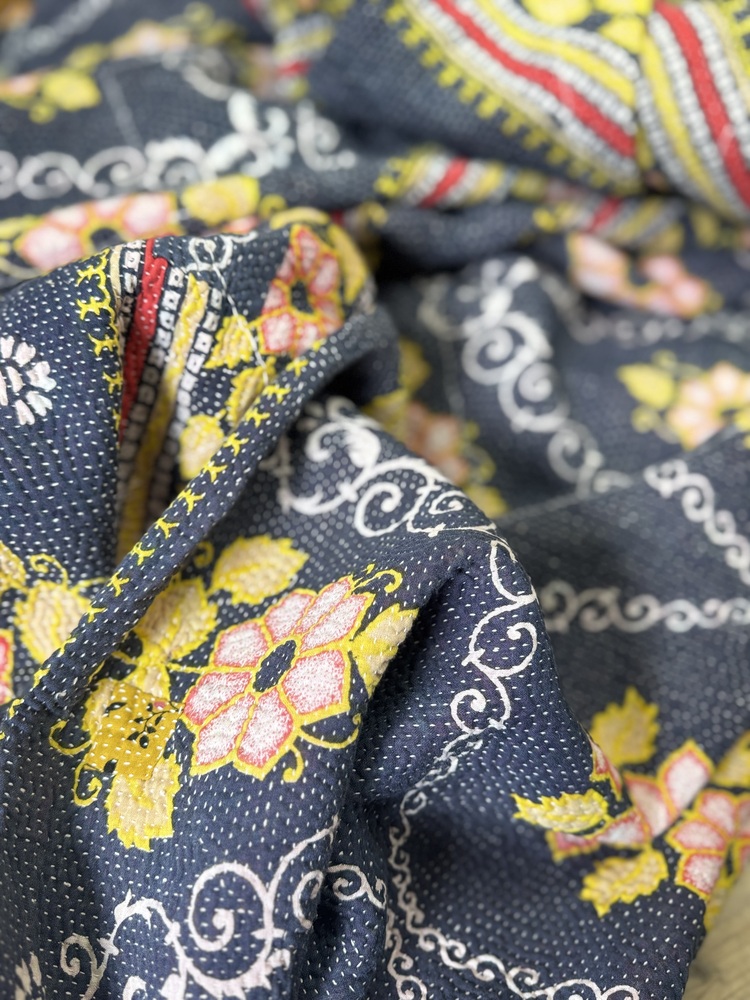 Exquisite vintage Kantha quilt featuring authentic hand-stitched Indian patchwork, responsibly sourced and perfect as unique homeware.