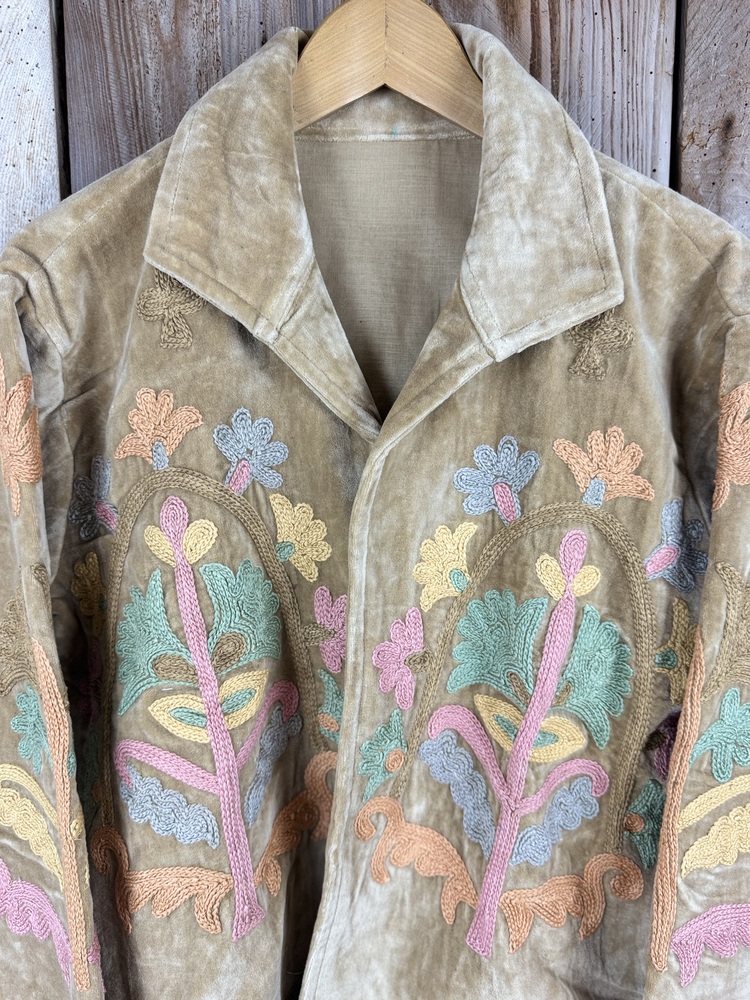 Hand embroidered cotton velvet jacket with soft texture, cosy easy fit, and intricate artisanal detailing.