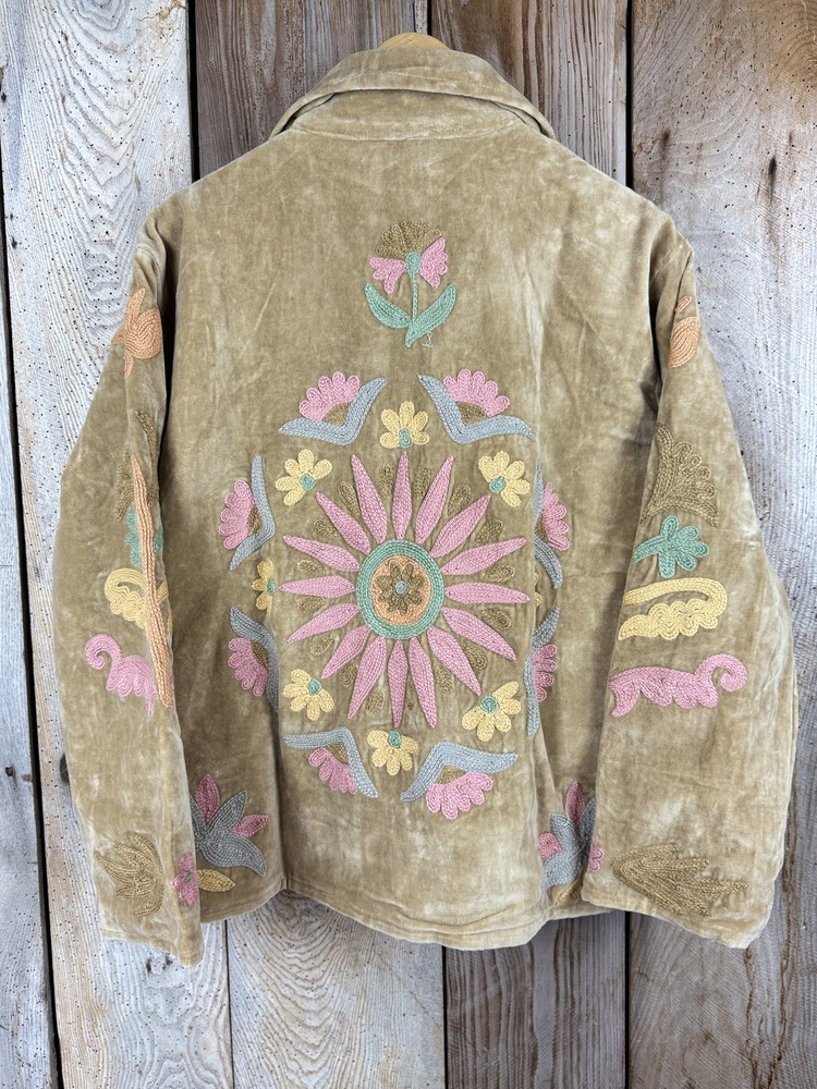 Hand embroidered cotton velvet jacket with soft texture, cosy easy fit, and intricate artisanal detailing.