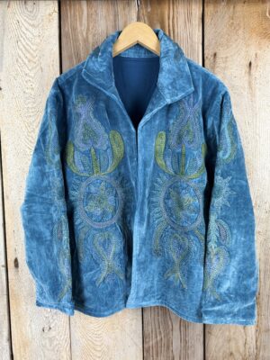 Hand embroidered cotton velvet jacket with soft texture, cosy easy fit, and intricate artisanal detailing.