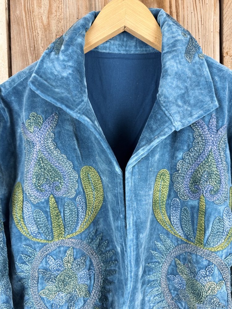 Hand embroidered cotton velvet jacket with soft texture, cosy easy fit, and intricate artisanal detailing.