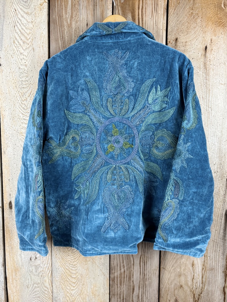 Hand embroidered cotton velvet jacket with soft texture, cosy easy fit, and intricate artisanal detailing.