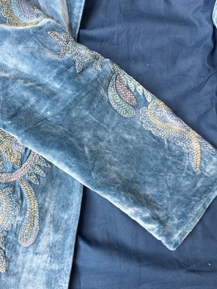 Hand embroidered cotton velvet jacket with soft texture, cosy easy fit, and intricate artisanal detailing.
